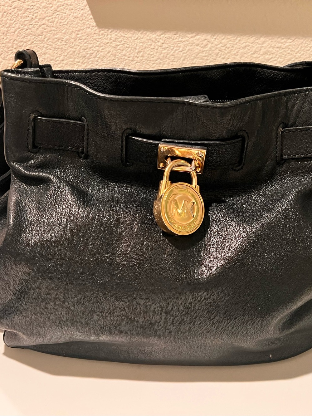 Michael Kors Black Leather Shoulder Bag with Gold Padlock Accent